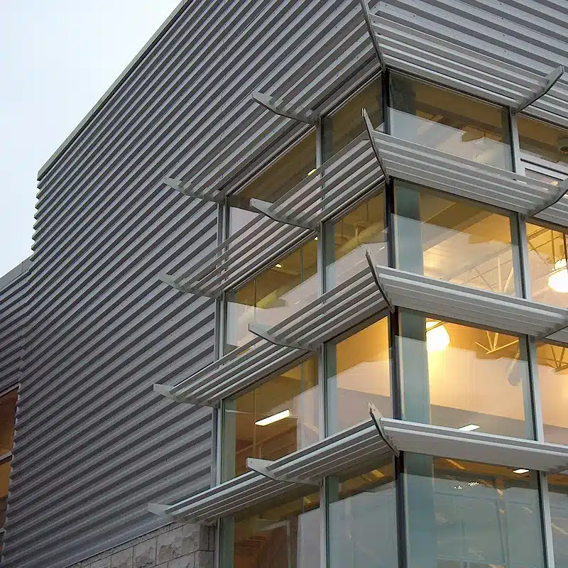 Building With Sunshade Over Windows